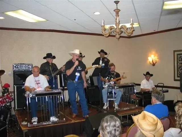 A group of people in cowboy hats playing music.